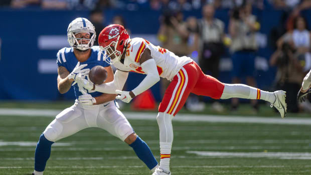 Sep 25, 2022; Indianapolis, Indiana, USA; Indianapolis Colts wide receiver Michael Pittman Jr. (11) catches a pass while being covered by Kansas City Chiefs cornerback L'Jarius Sneed (38) during the second half at Lucas Oil Stadium.